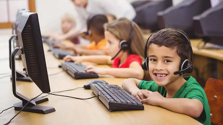 Children in class working at PCs